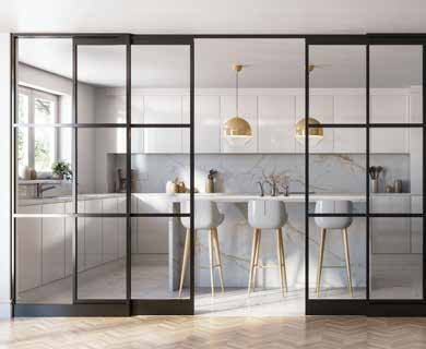 Sliding glazed room divider between a kitchen and dining area